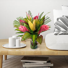 Green, pink & yellow tropical bouquet in vase with (2) Ginger Pink, (1) Ginger Red, (2) Chili Pink Picks, (2) Anglonema, (2) Arrow Palm, (6) Cordelyne, (1) Croton Tip Fountain, (2) Masajeana, (2) Pandanus,. 