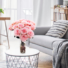 vase of Pink passion roses with buds filled with a full flower of gentle, powdery pink petals
