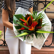 Woman holding Joy bouquet in tissue paper