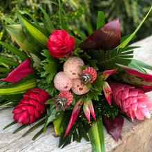 pink, green, and beige tropical bouquet of (3) Ginger Pink, (2) Sassy, (2) Ananas, (3) Pandanus, (1) Croton Pecoso, (2) Arrow Palm, (3) Xantal, (5) Cordelines Leaves, (2) Masajeanas, (1) Anglonema, (2) Lettuce Ferns.